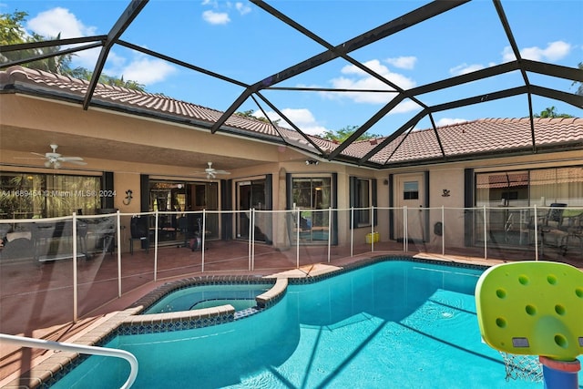 view of swimming pool featuring a lanai, ceiling fan, and a patio