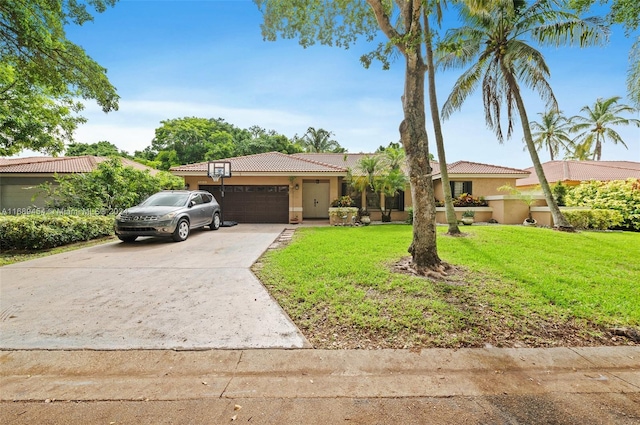 mediterranean / spanish house with a garage and a front yard