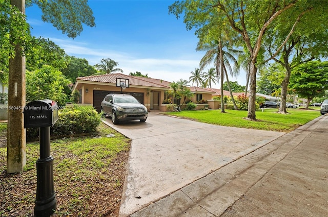 view of front facade featuring a garage and a front lawn