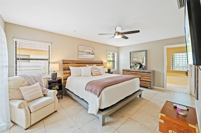 bedroom with ceiling fan and light tile patterned floors