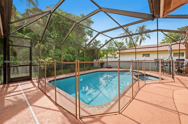 view of pool featuring a lanai and a patio