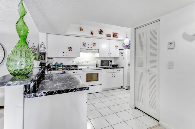 kitchen with white cabinetry, sink, a textured ceiling, light tile patterned floors, and white appliances