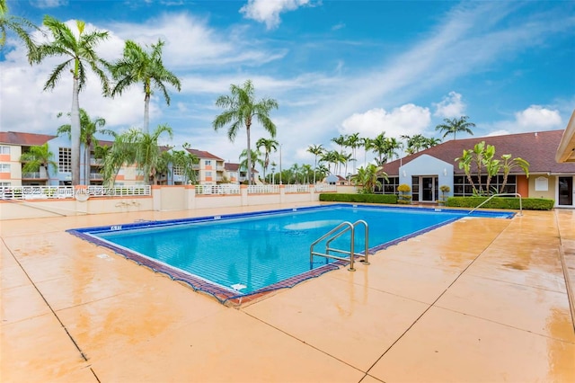 view of swimming pool featuring a patio area