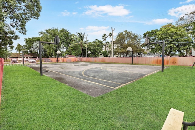 view of basketball court featuring a lawn