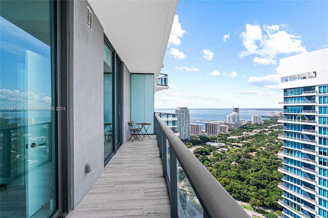 balcony featuring a water view