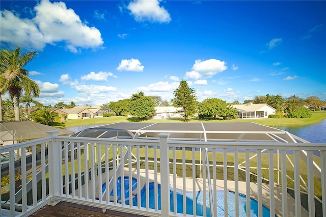 balcony featuring a water view