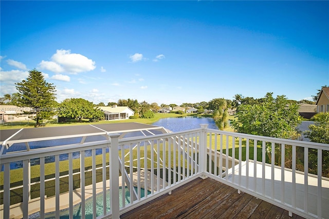 wooden terrace featuring a water view