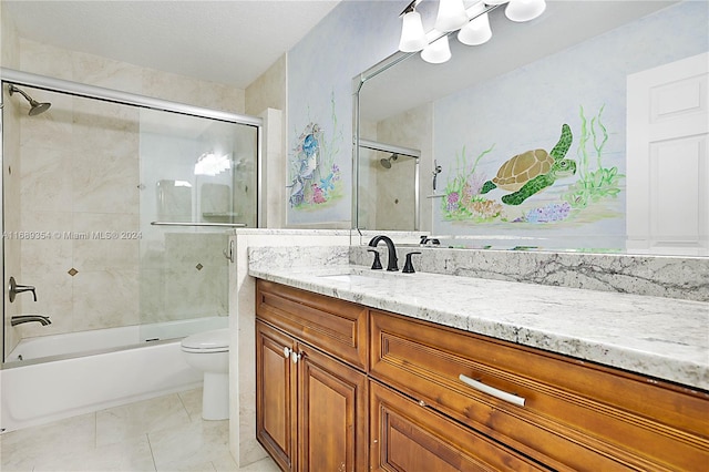 full bathroom featuring enclosed tub / shower combo, tile patterned floors, toilet, and vanity