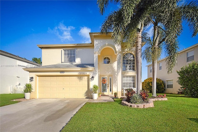 view of front of property featuring a garage and a front lawn