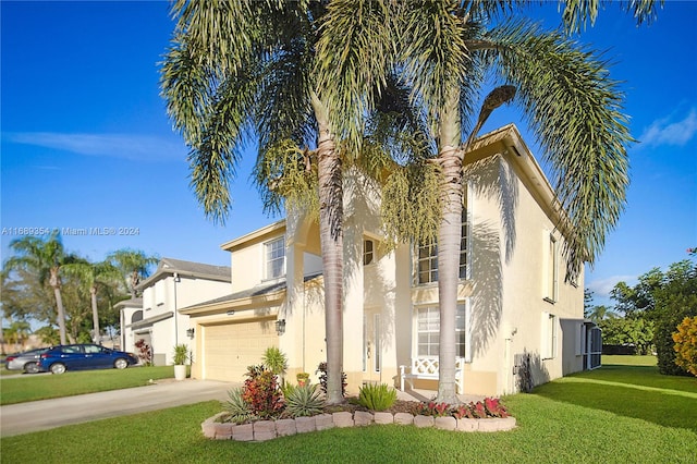 mediterranean / spanish-style house featuring a garage and a front yard