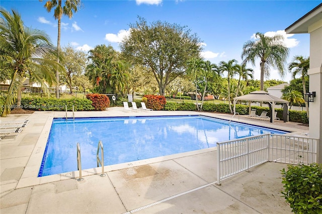 view of swimming pool featuring a patio area and a gazebo