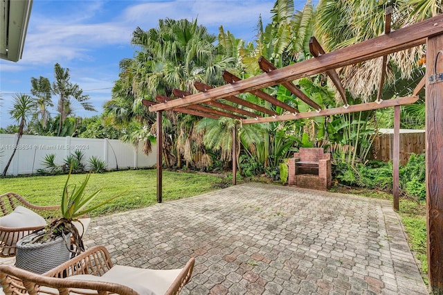 view of patio featuring a fireplace and a pergola