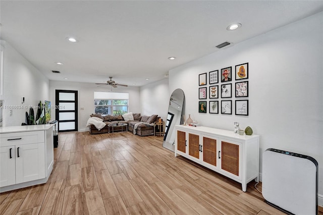 interior space with ceiling fan and light wood-type flooring