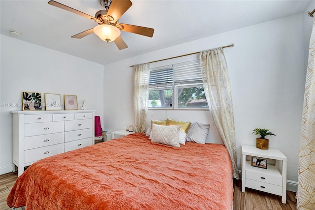 bedroom with ceiling fan and light hardwood / wood-style flooring