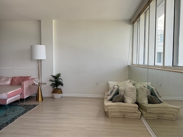 sitting room with light hardwood / wood-style flooring