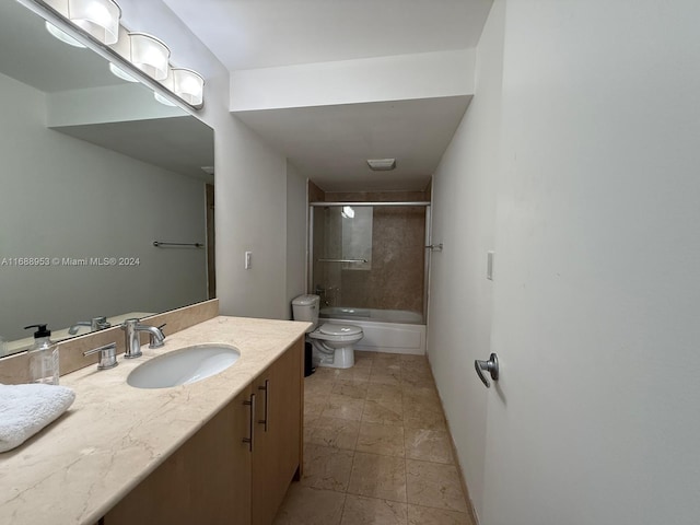 full bathroom with bath / shower combo with glass door, vanity, and toilet