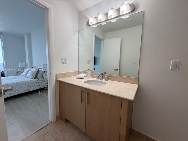 bathroom featuring vanity and hardwood / wood-style flooring