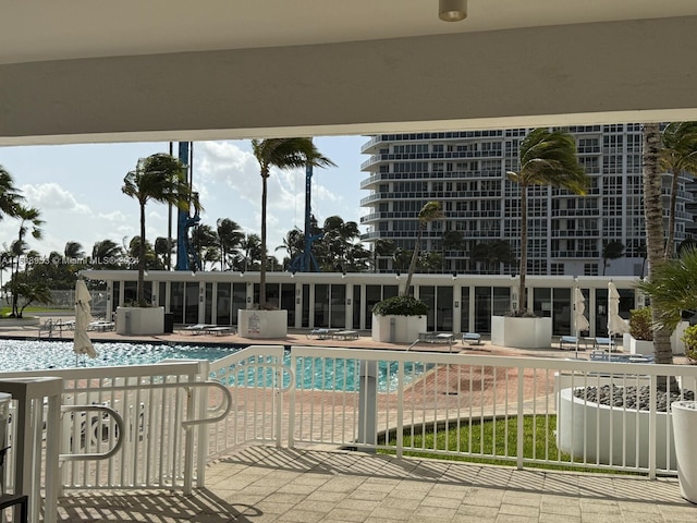 view of swimming pool featuring a patio area