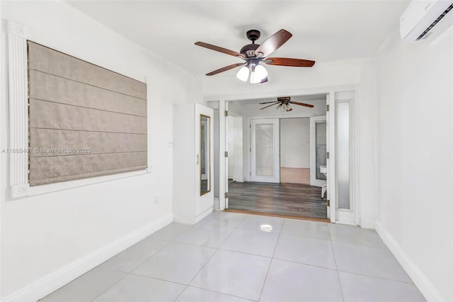 hall featuring light tile patterned floors and a wall unit AC