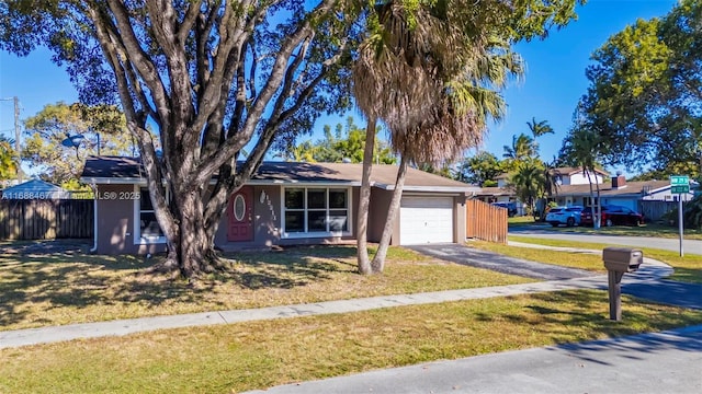 ranch-style house with a front lawn and a garage