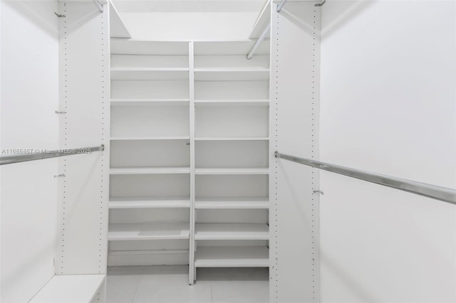 spacious closet featuring tile patterned floors