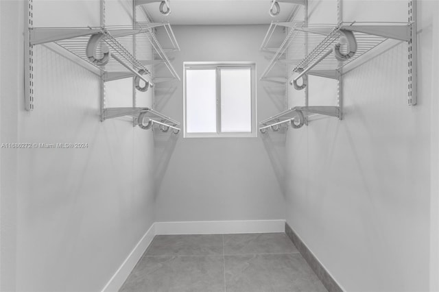 spacious closet with tile patterned flooring