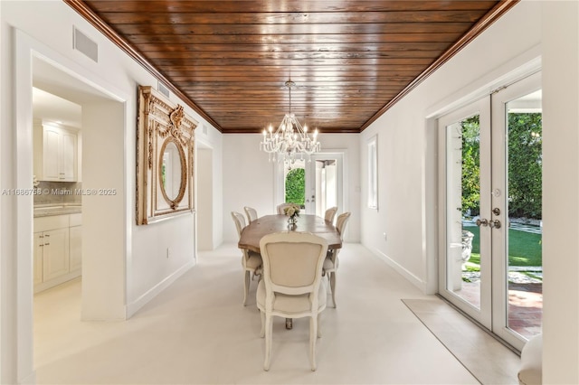 dining space with a healthy amount of sunlight, french doors, wood ceiling, and ornamental molding