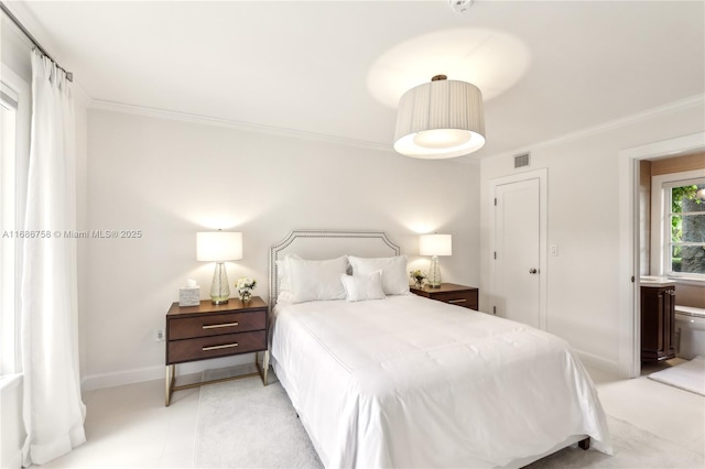 bedroom with crown molding