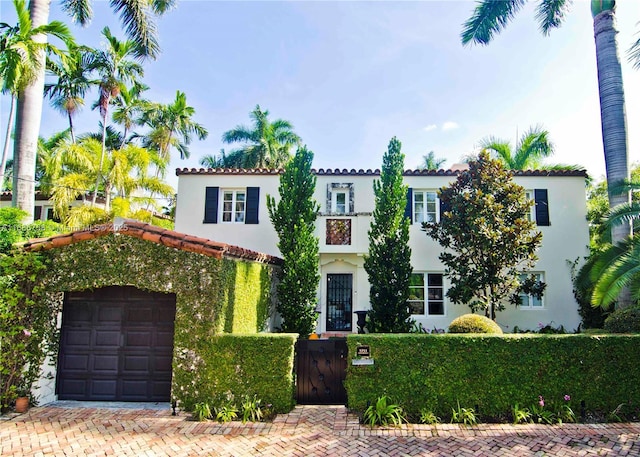 mediterranean / spanish house featuring a garage