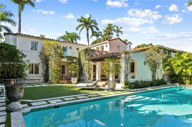 back of house with a patio