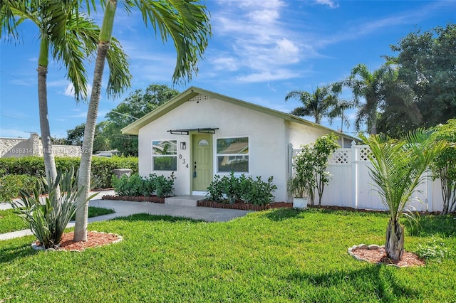 single story home with a front yard