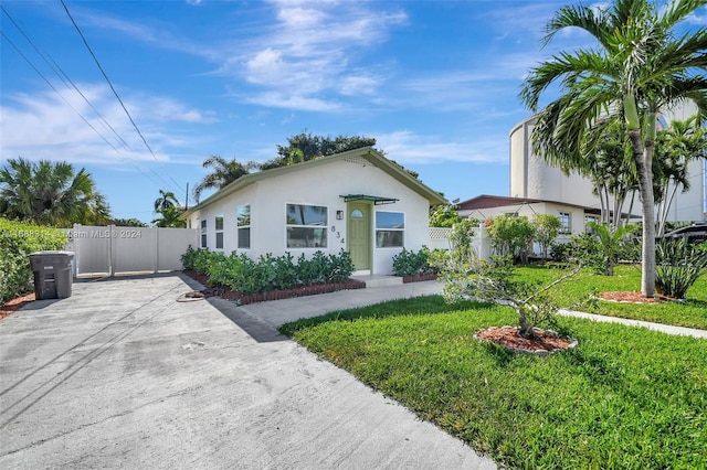 bungalow with a front yard