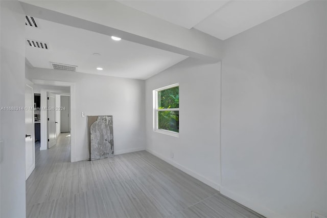 spare room featuring light hardwood / wood-style flooring