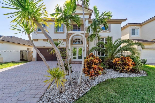 view of front of property featuring french doors and a garage