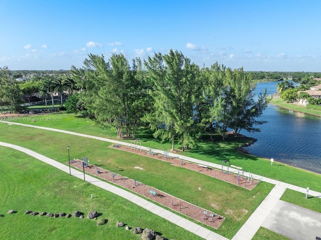 surrounding community featuring a yard and a water view