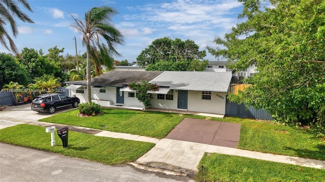 single story home featuring a front yard