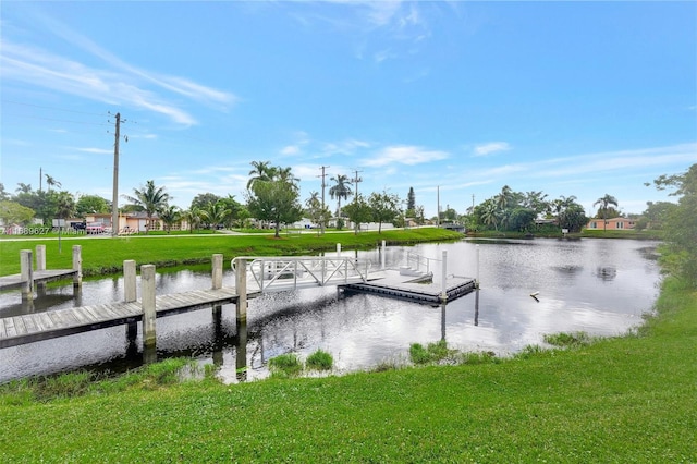 dock area featuring a yard and a water view