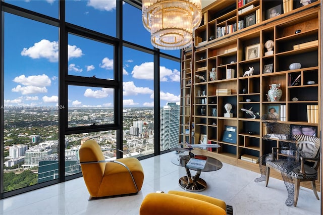 sitting room featuring an inviting chandelier and floor to ceiling windows