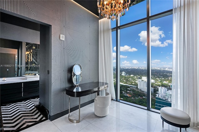 bathroom featuring tile patterned flooring, vanity, and a wall of windows