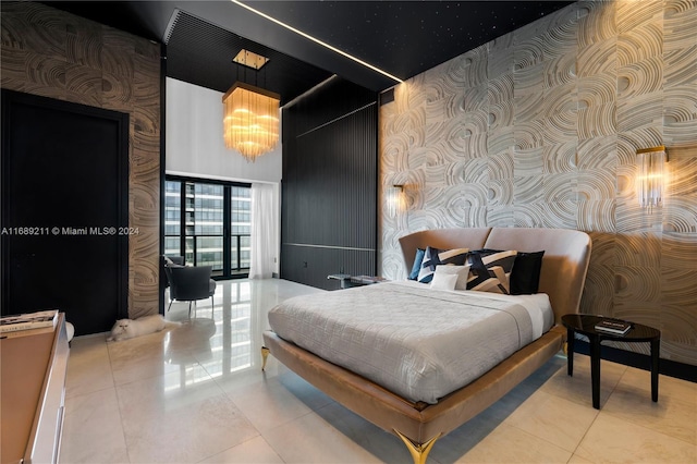 tiled bedroom with an inviting chandelier