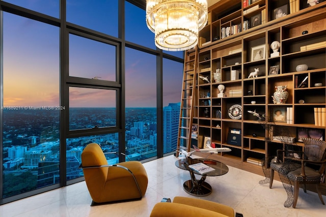 living area with tile patterned floors, floor to ceiling windows, and a notable chandelier