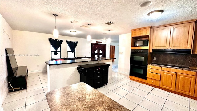 kitchen with light tile patterned flooring, black appliances, tasteful backsplash, a textured ceiling, and hanging light fixtures