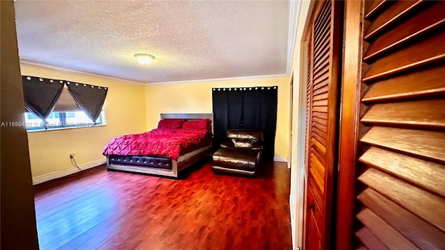 bedroom featuring a textured ceiling, hardwood / wood-style flooring, and crown molding