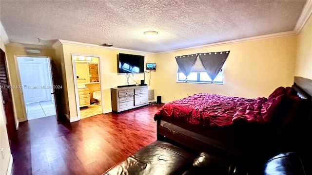 bedroom with dark hardwood / wood-style floors, connected bathroom, a textured ceiling, and crown molding