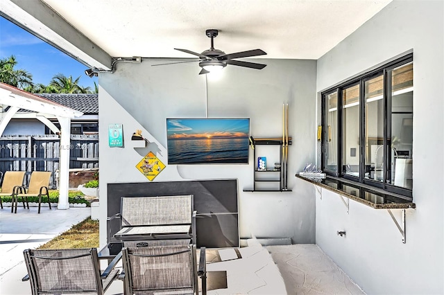 view of patio / terrace featuring ceiling fan