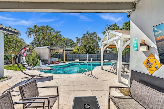 view of swimming pool with a patio area and a gazebo