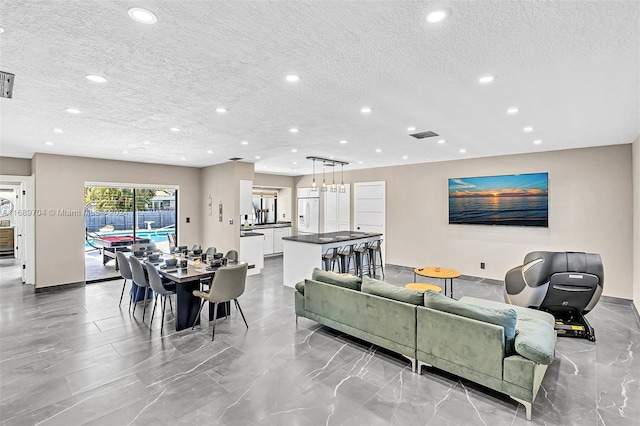 living room with a textured ceiling