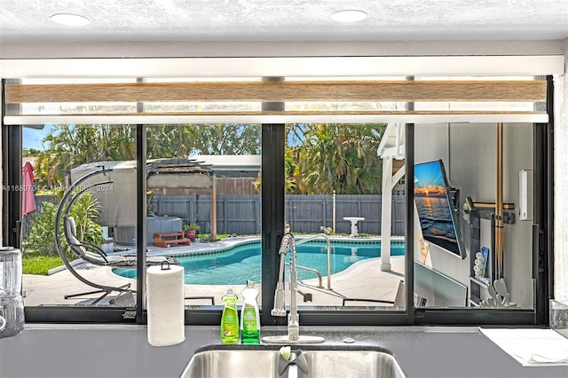 view of pool featuring sink