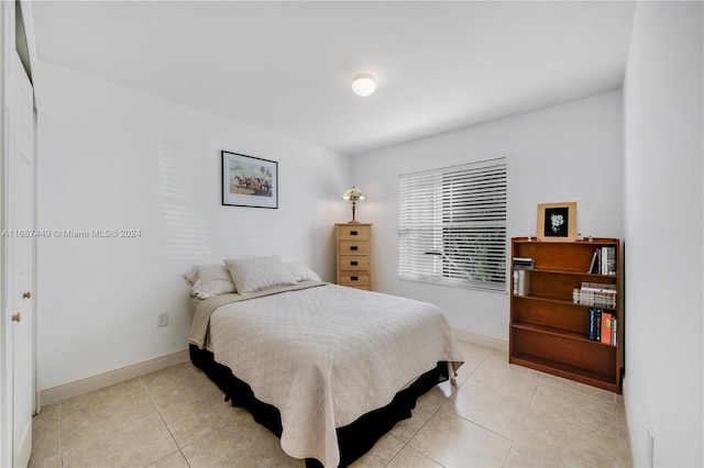 bedroom with light tile patterned flooring