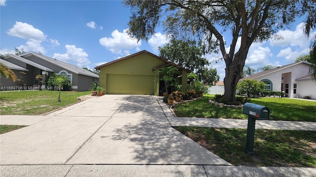 single story home with a garage and a front lawn